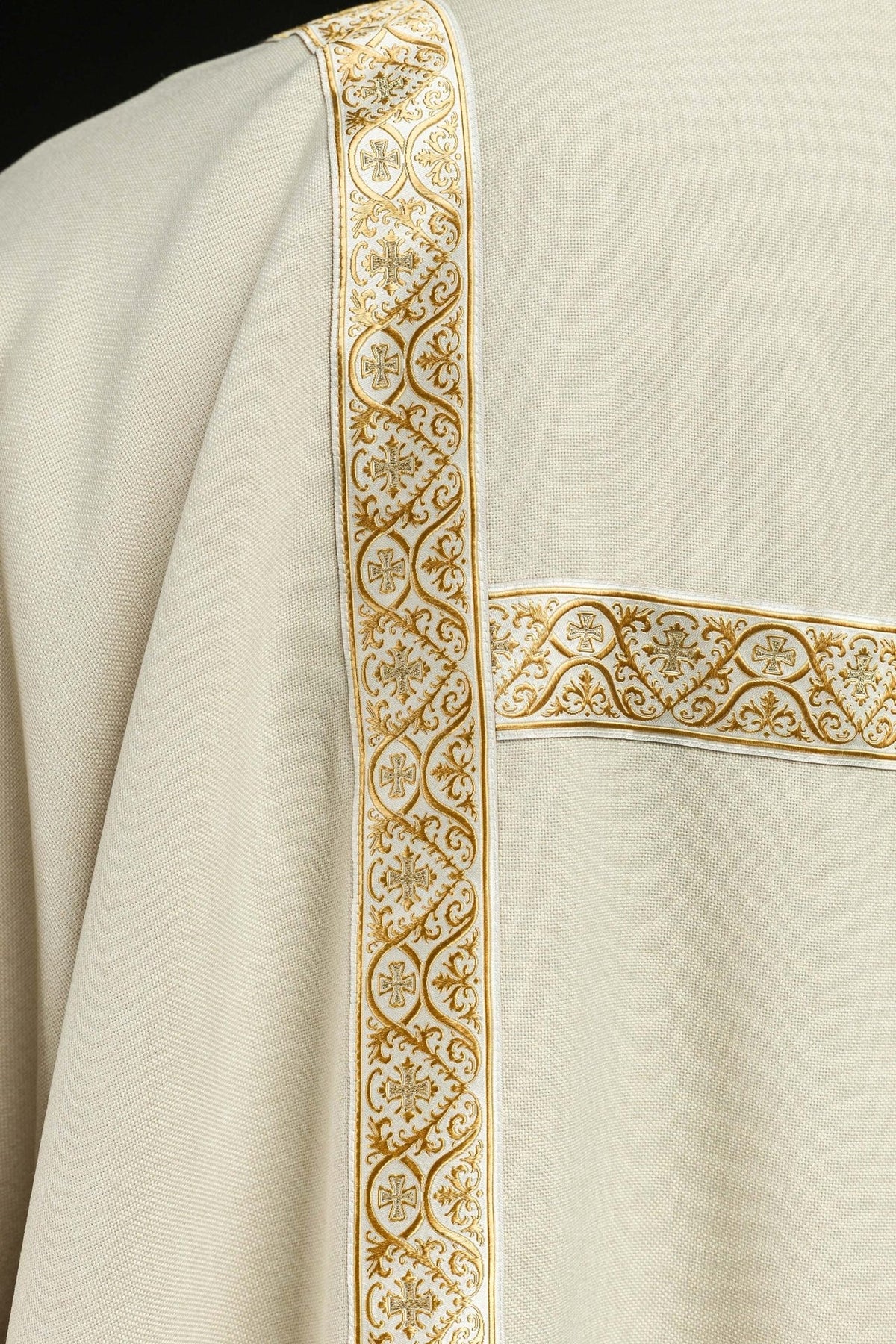 Ecru dalmatic orphrey close-up showing ornate gold crosses and scrollwork