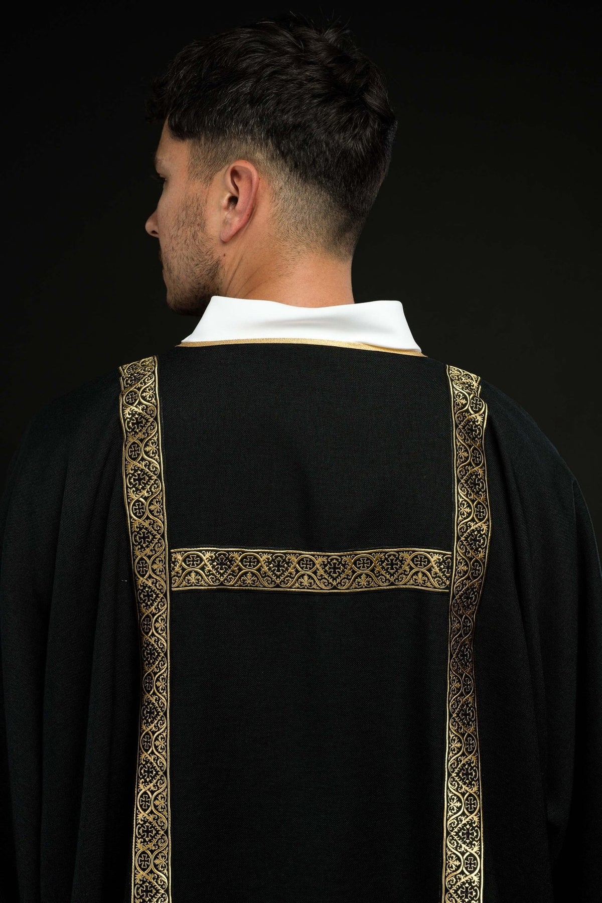 Black dalmatic back close-up with gold jacquard orphreys