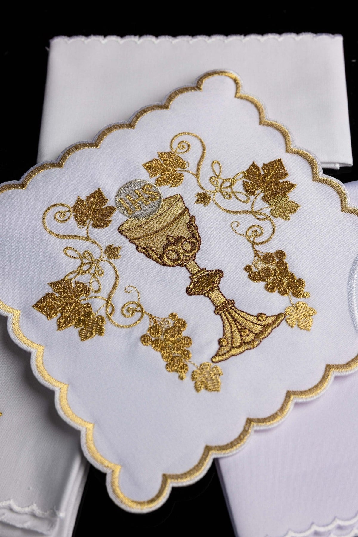Altar linen set close-up of gold chalice embroidery with grapevine motifs and scalloped edging