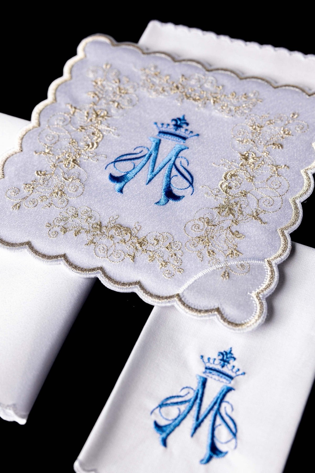 Embroidered altar linen set detail with blue Marian motif and ornate gold embroidery