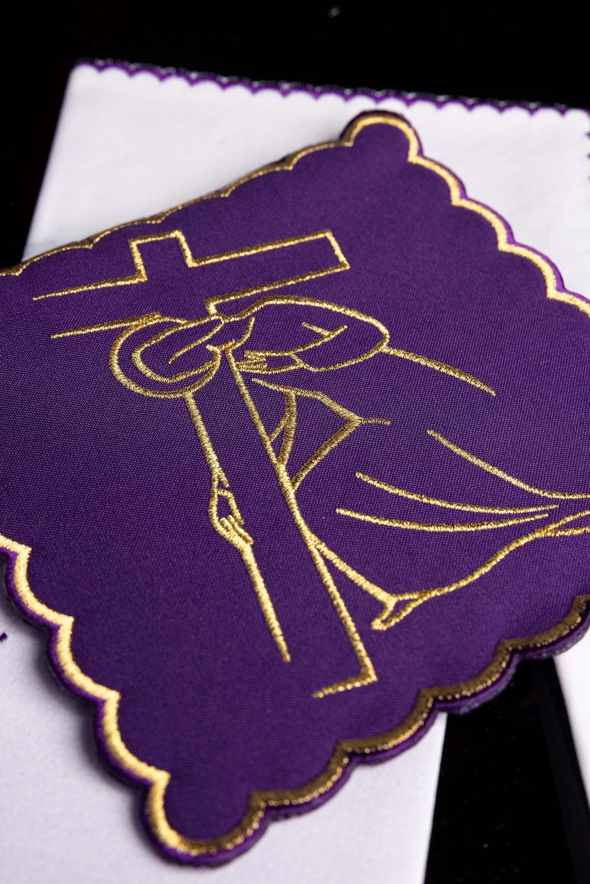 Altar linen set close-up of gold embroidery on a purple Station of the Cross panel