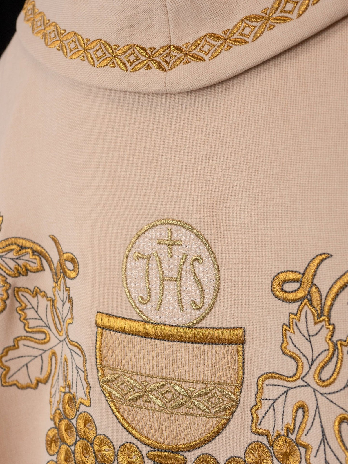 Ecru chasuble detail showing chalice, host and gold collar trim