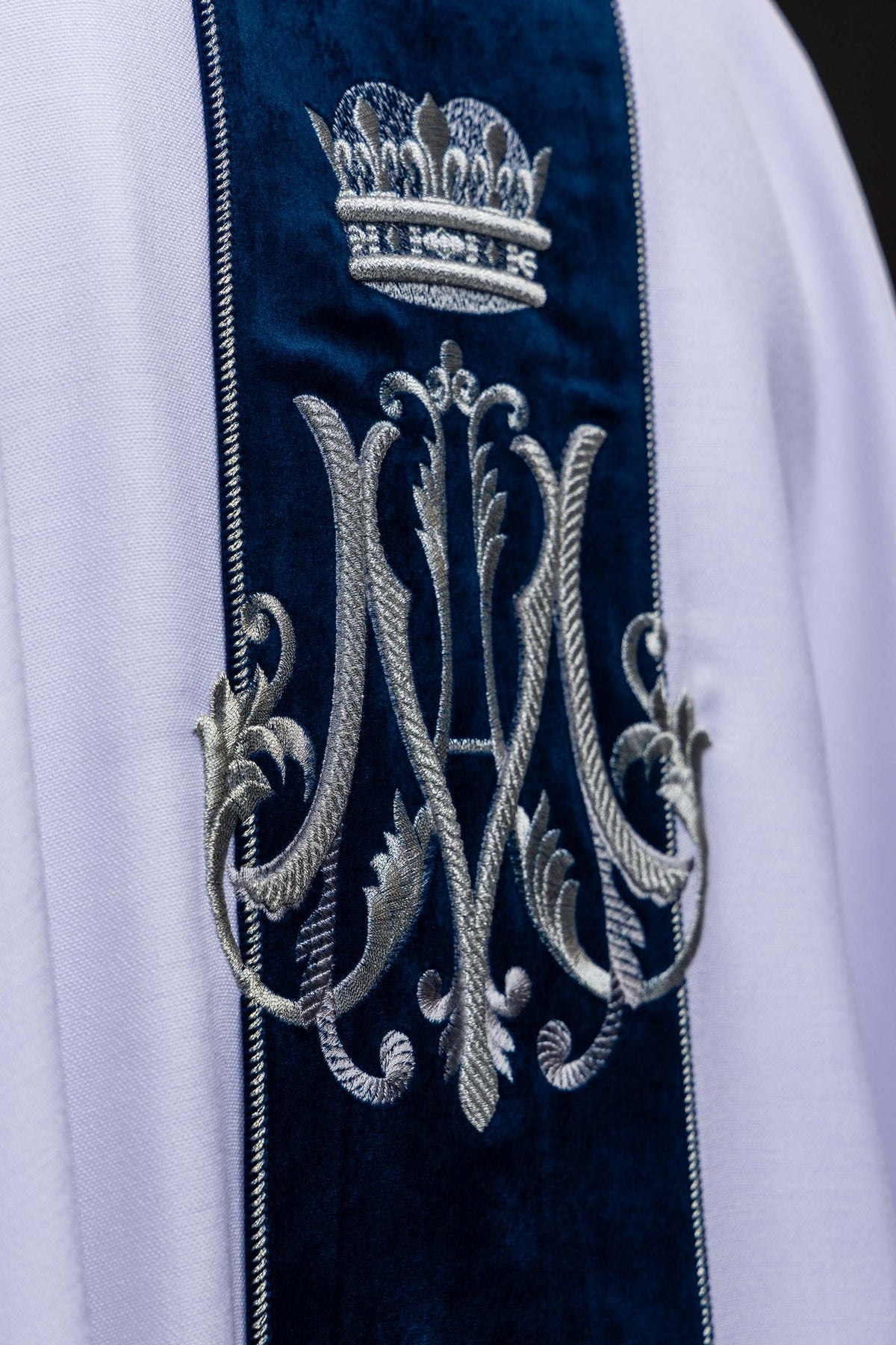 Marian chasuble close-up showing silver embroidered Marian motif on velvet
