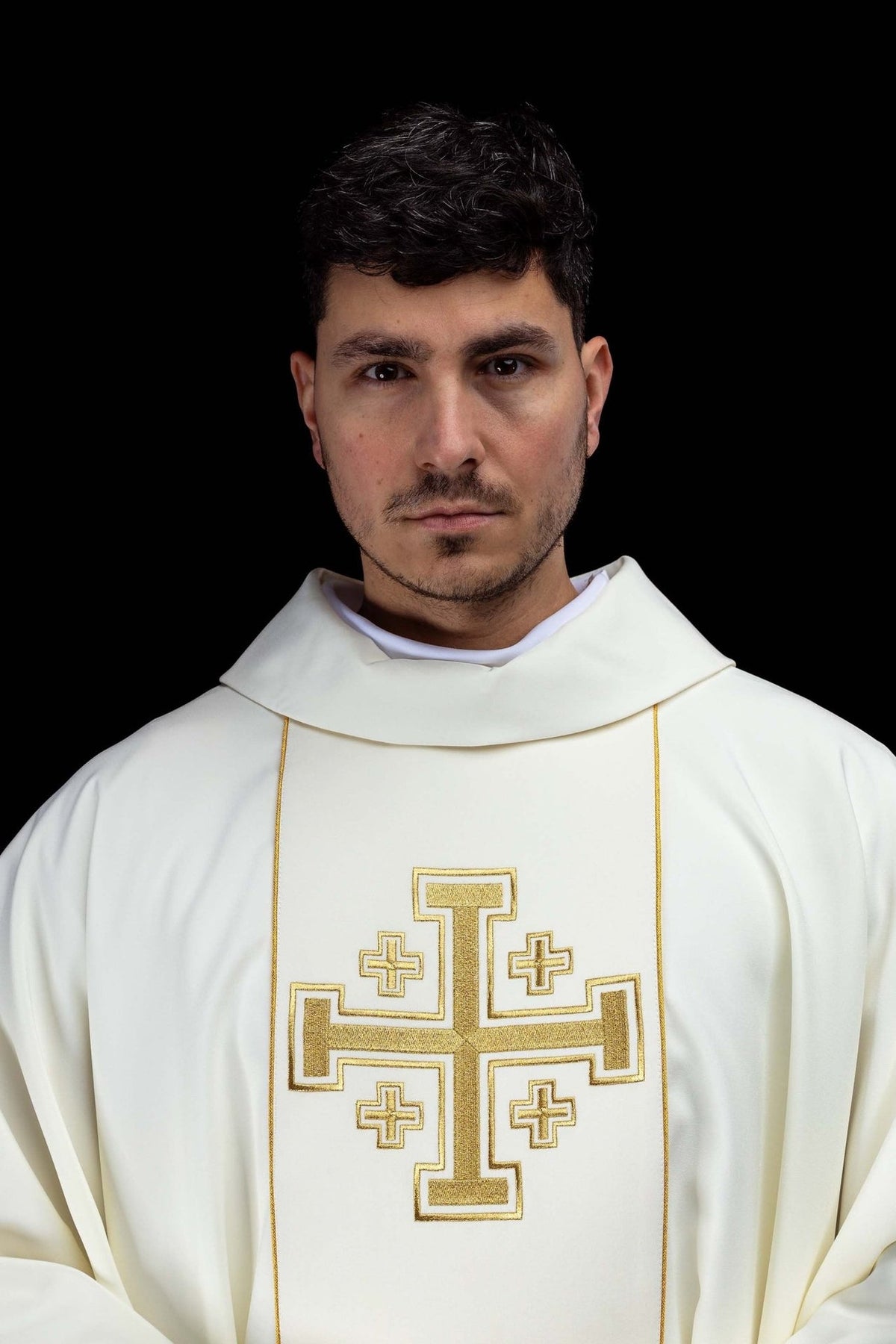 Ecru chasuble close-up showing stand-up collar and gold Jerusalem cross embroidery