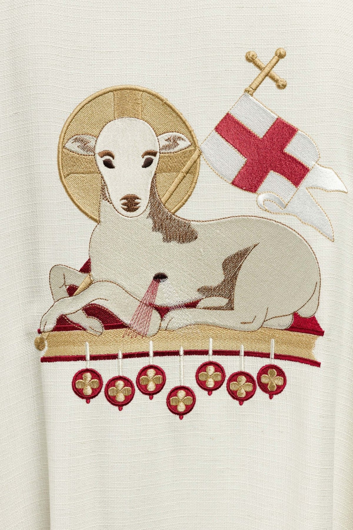 Lamb chasuble embroidery close-up with Agnus Dei and cross flag