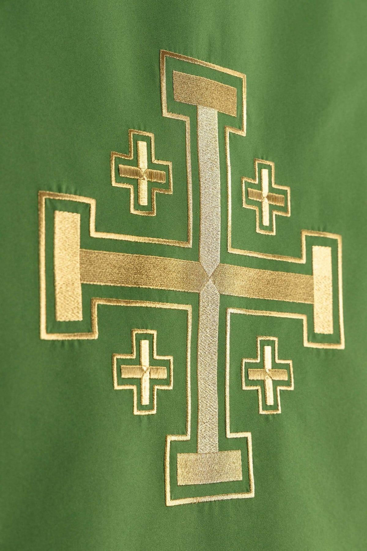 Jerusalem cross embroidery close-up on green church lectern cover