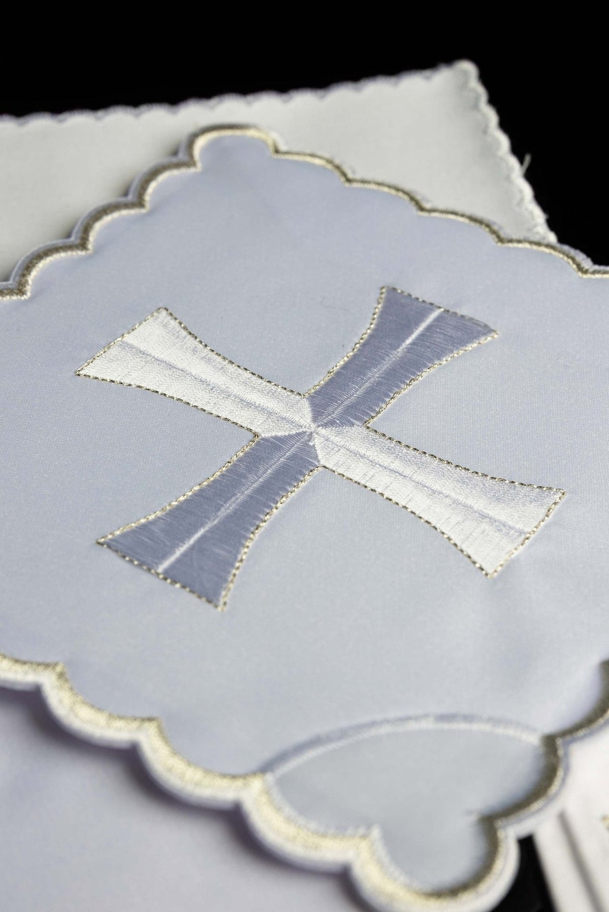 Altar linen set close-up showing silver and white cross embroidery