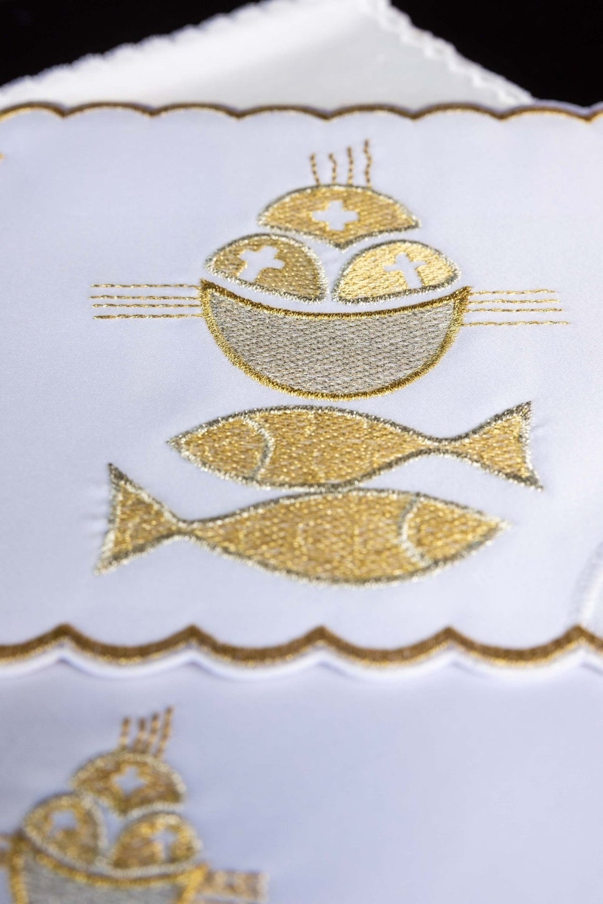 Altar linen set close-up showing gold embroidered bread and two fish motif