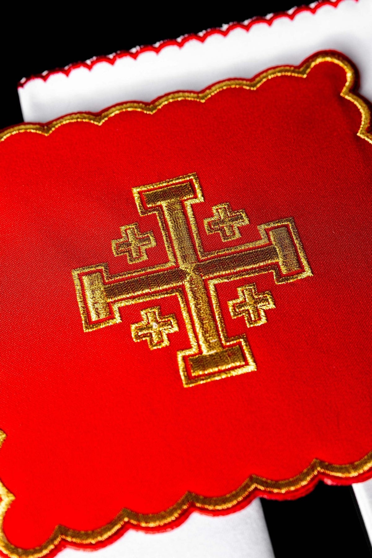 Altar linen set close-up of red cloth with gold Jerusalem cross embroidery