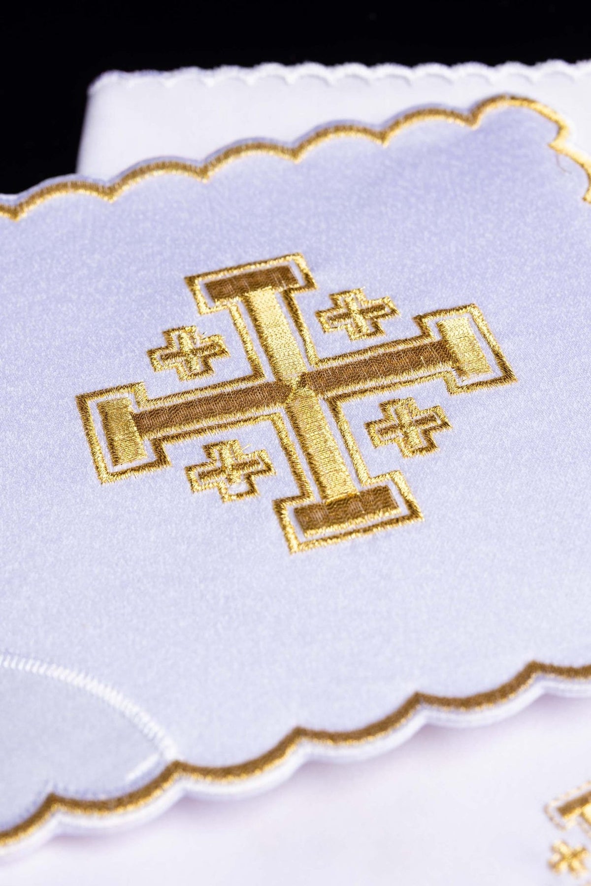 Altar linen set close-up showing a large gold cross embroidery and scalloped gold edging