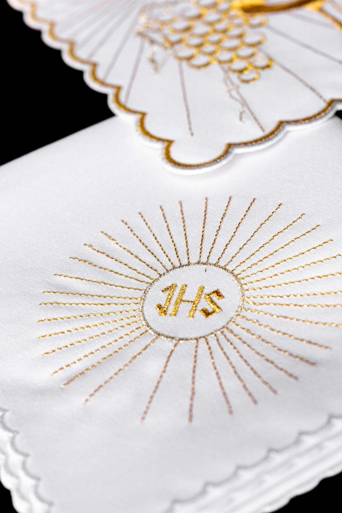 Altar linen set close-up showing gold IHS monogram and radiating embroidery