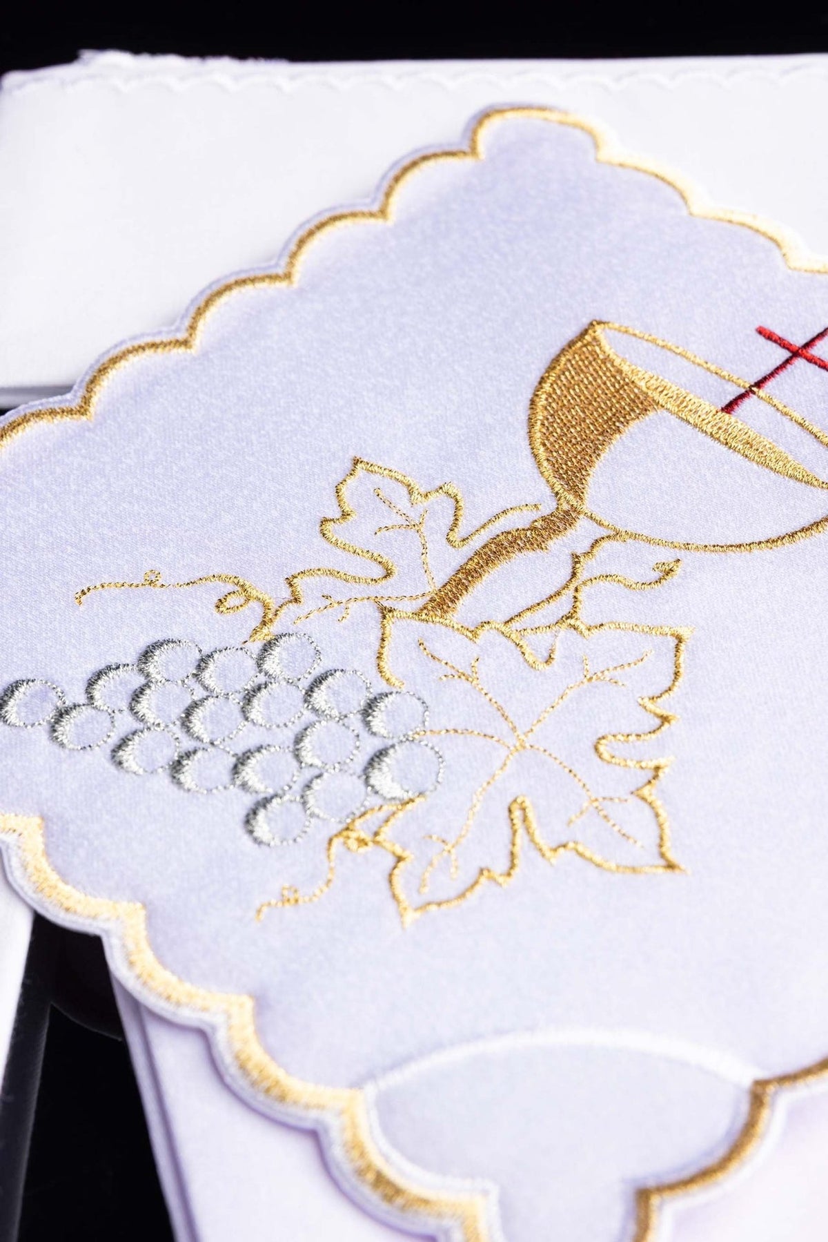 Altar linen set close-up showing gold chalice, vine and silver grapes embroidery