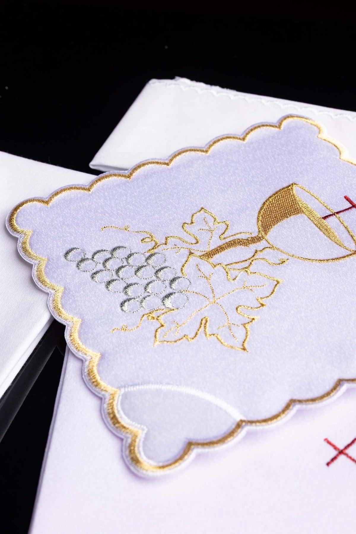 Altar linen set close-up showing gold vine and silver grapes embroidery with scalloped edging