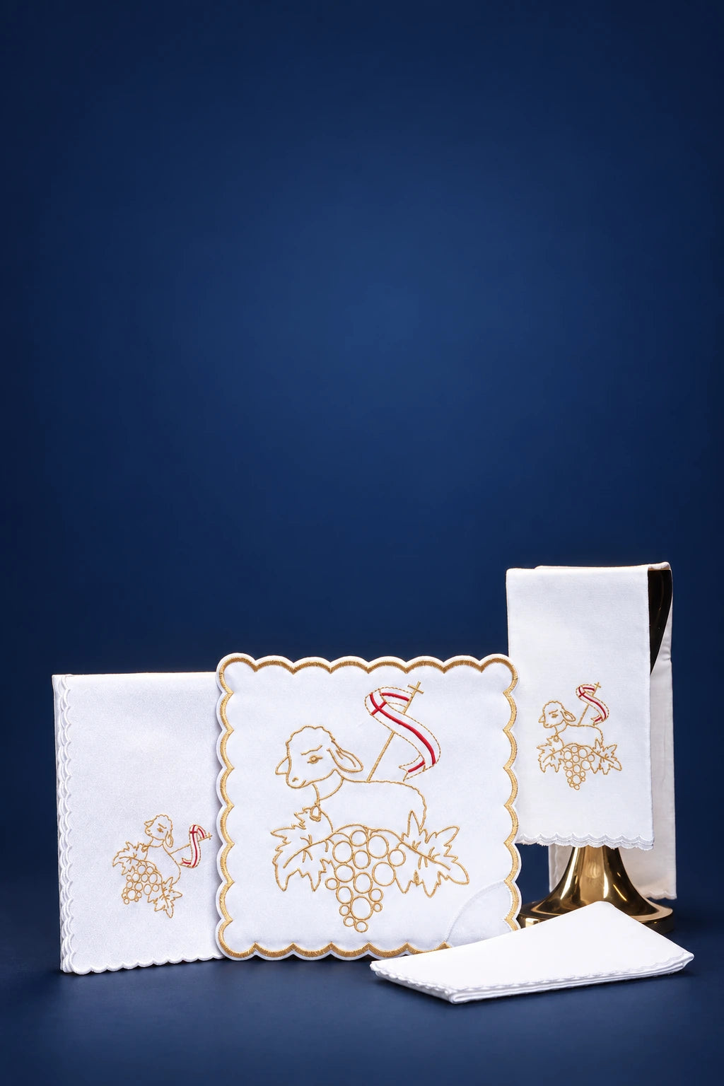 Embroidered Paschal Lamb Altar Linen Set shown unfolded in white with gold and red lamb embroidery