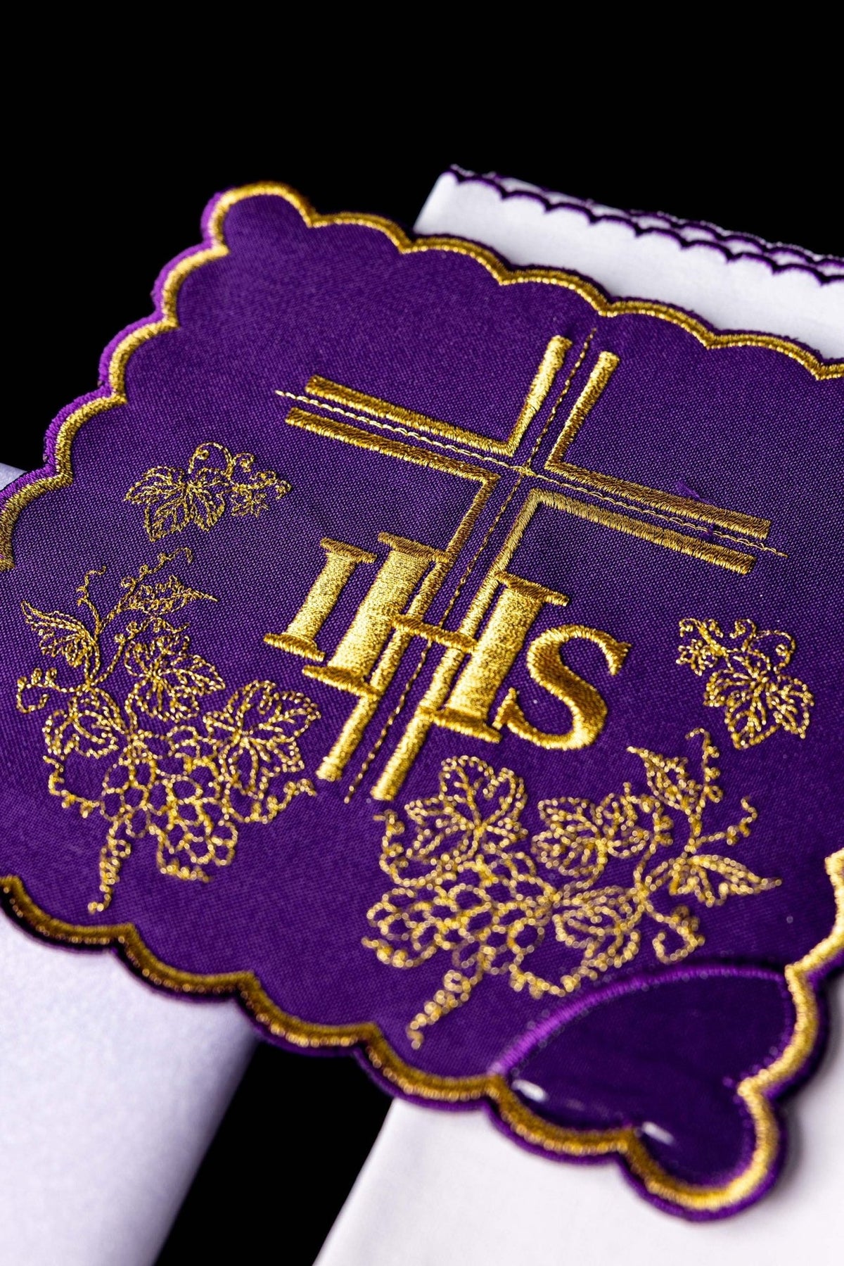 Purple altar linen set close-up showing gold IHS, cross and grape embroidery