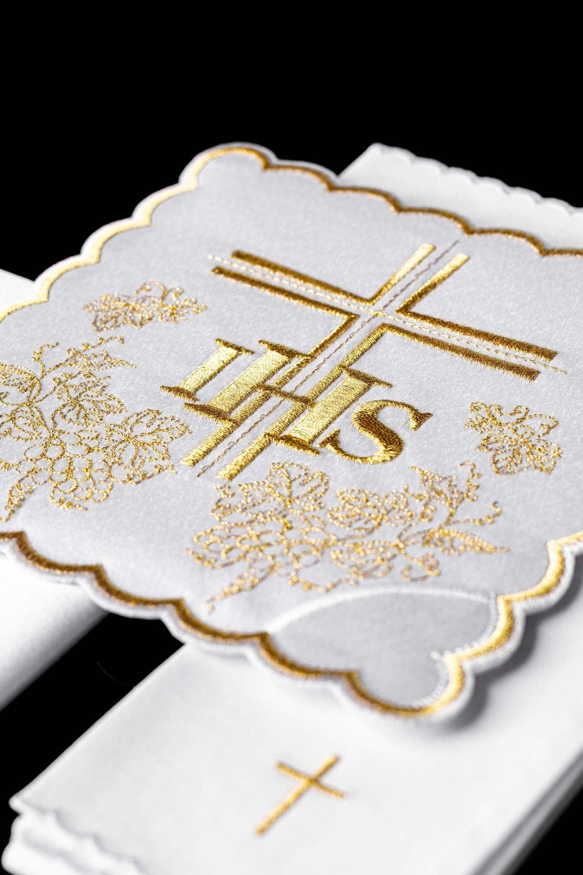Altar linen set close-up with gold cross, IHS and grape embroidery
