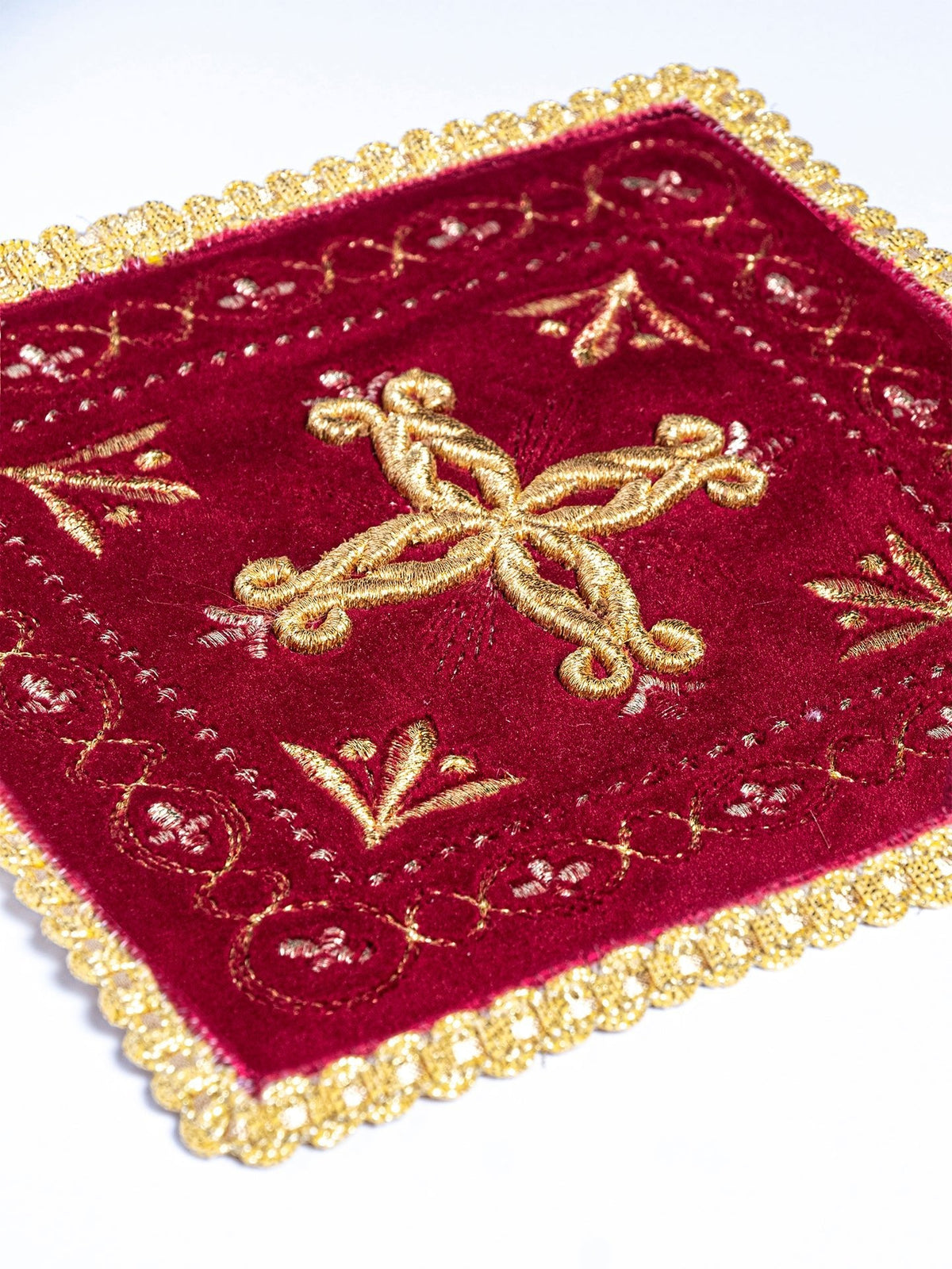 Red velvet chalice pall with gold embroidery, cross and decorative border