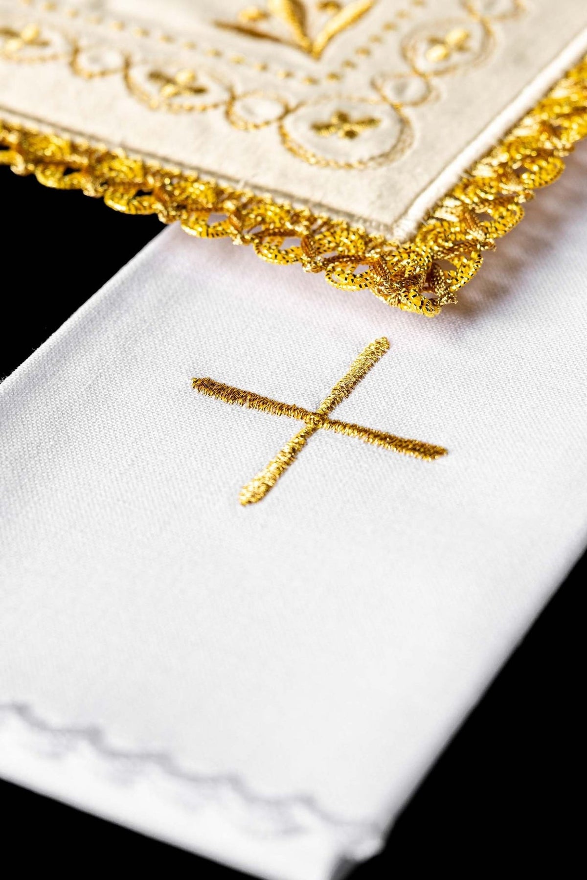 Altar linen set close-up showing gold cross embroidery and scalloped edge
