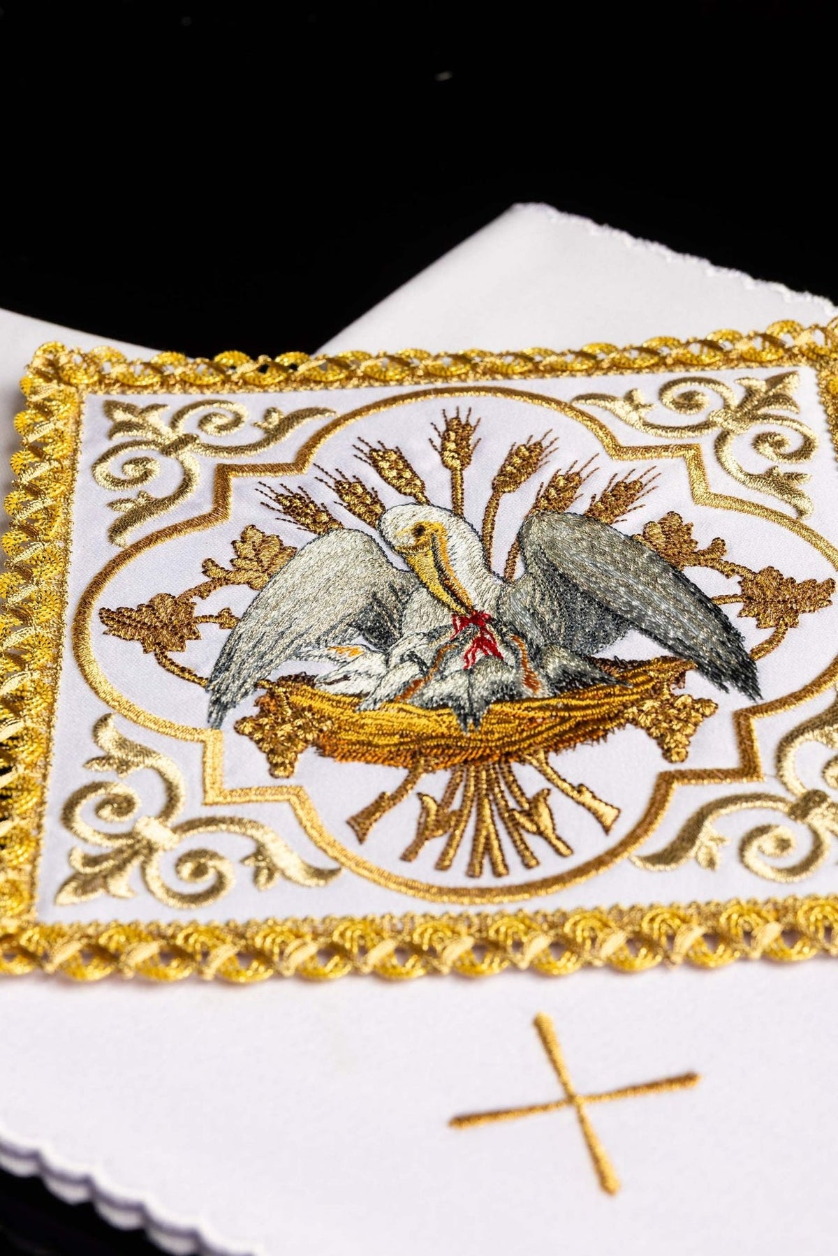 Altar linen set close-up showing pelican embroidery, wheat and gold border