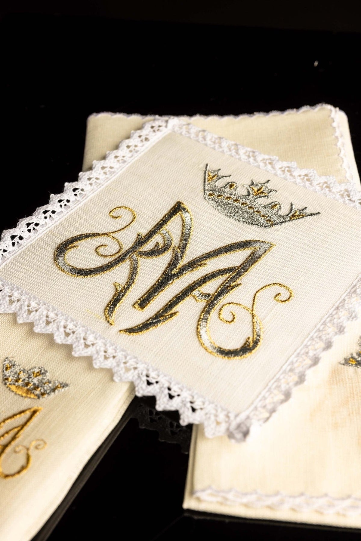 Altar linen set detail showing Our Lady embroidery in gold and silver thread with lace trim