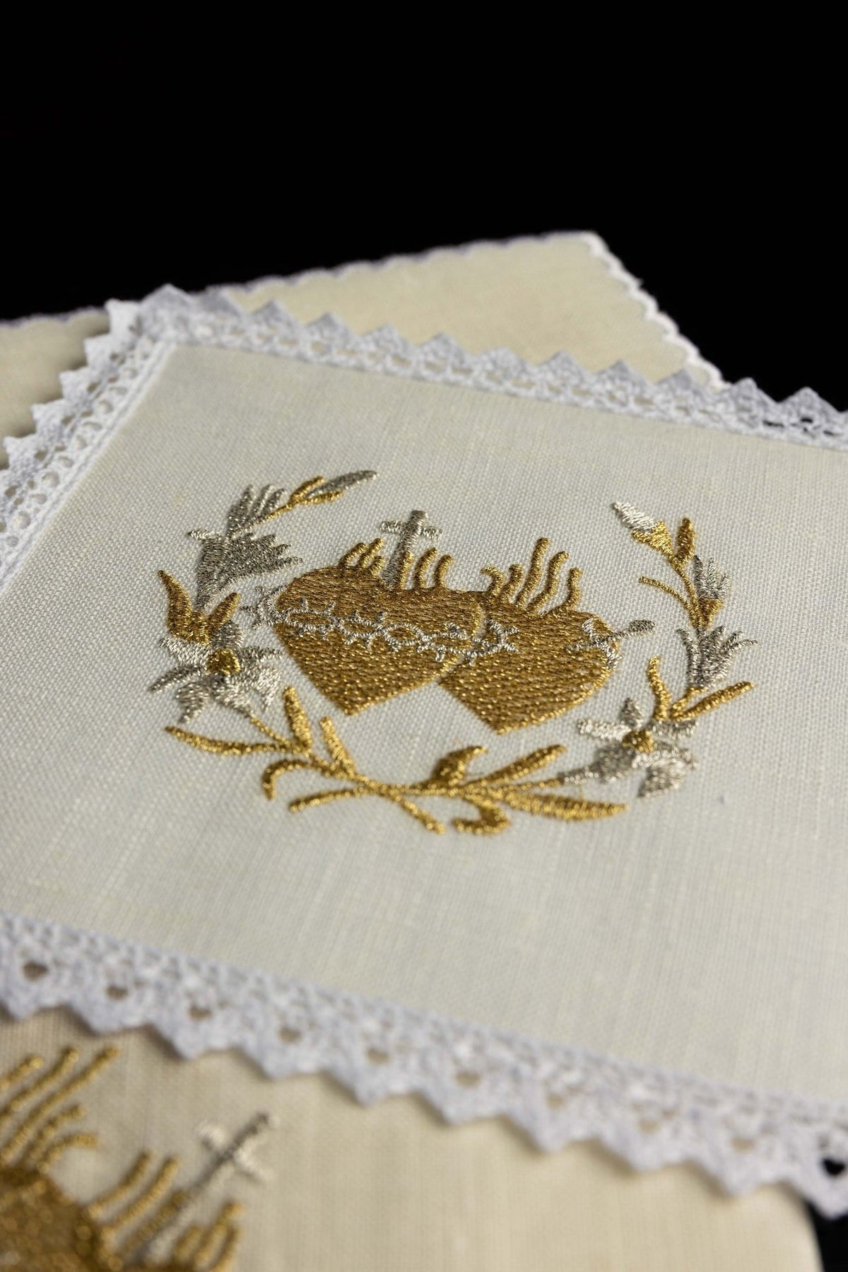 Altar linen set close-up showing ivory linen, lace edging and gold and silver Sacred Heart embroidery