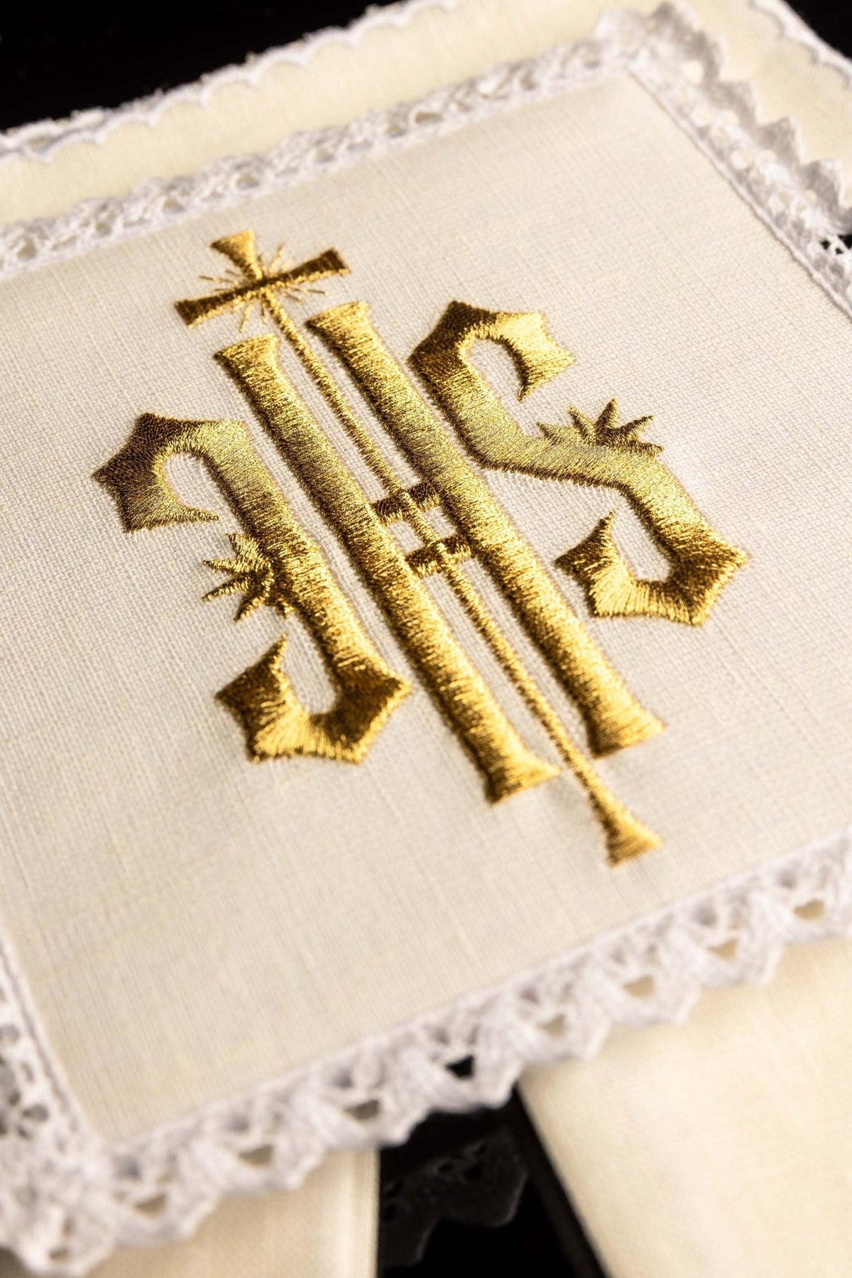 Altar linen set close-up with gold IHS embroidery and white lace trim