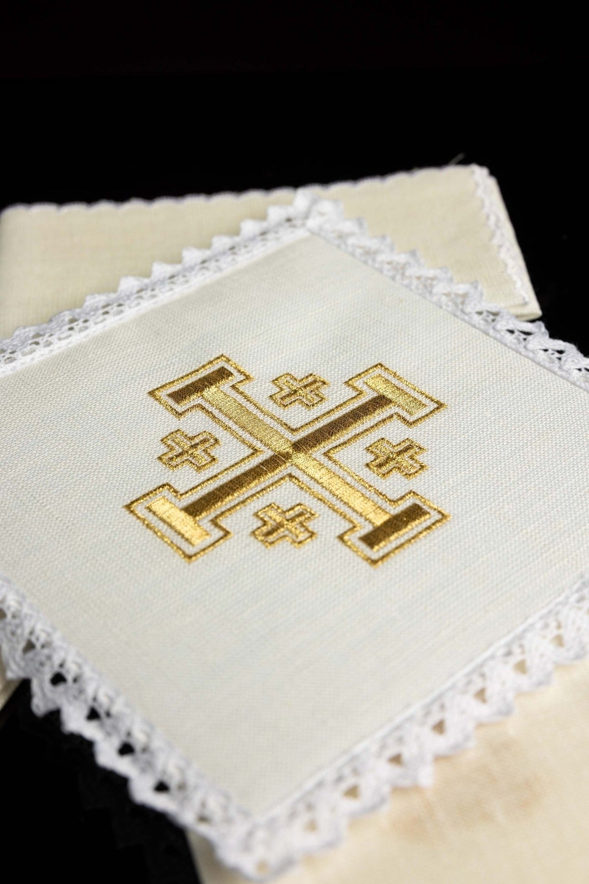 Altar linen set close-up showing gold Jerusalem cross embroidery and white lace trim