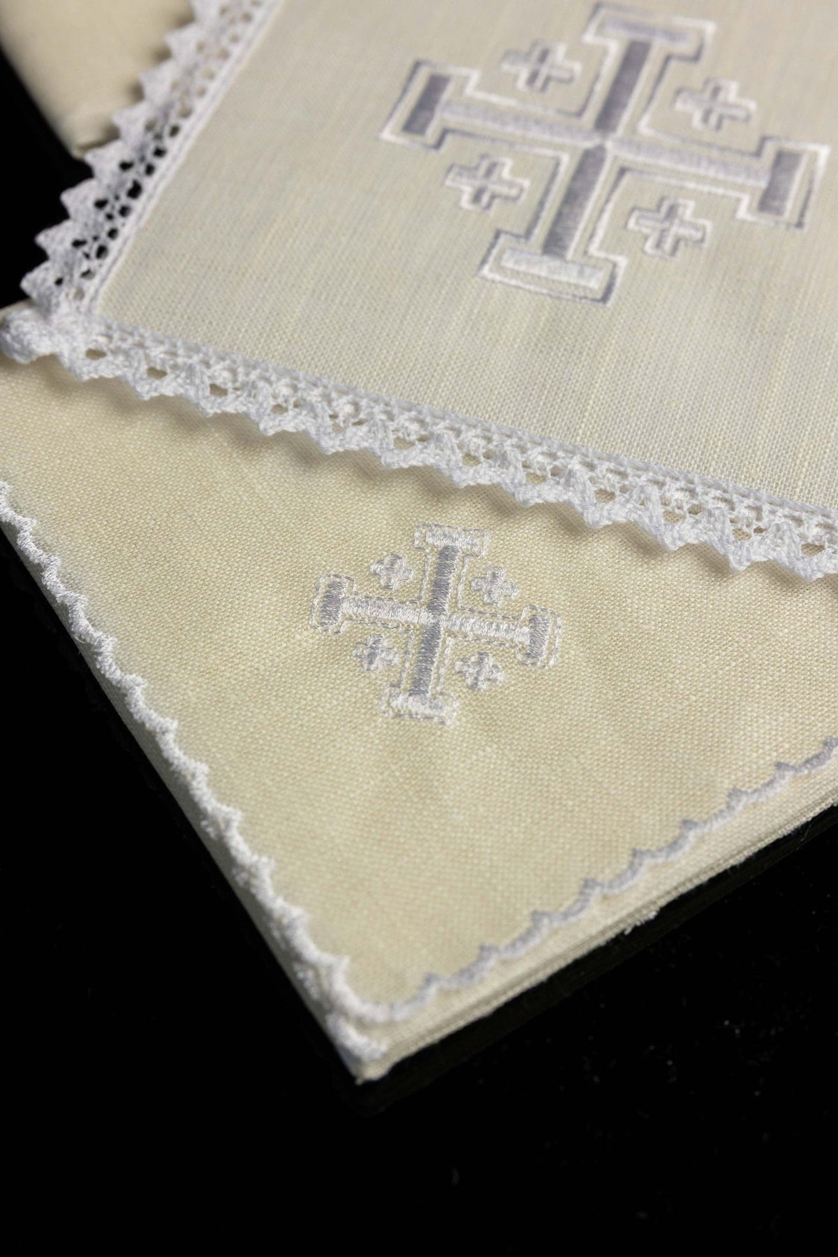Altar linen set detail showing embroidered Jerusalem cross on white linen
