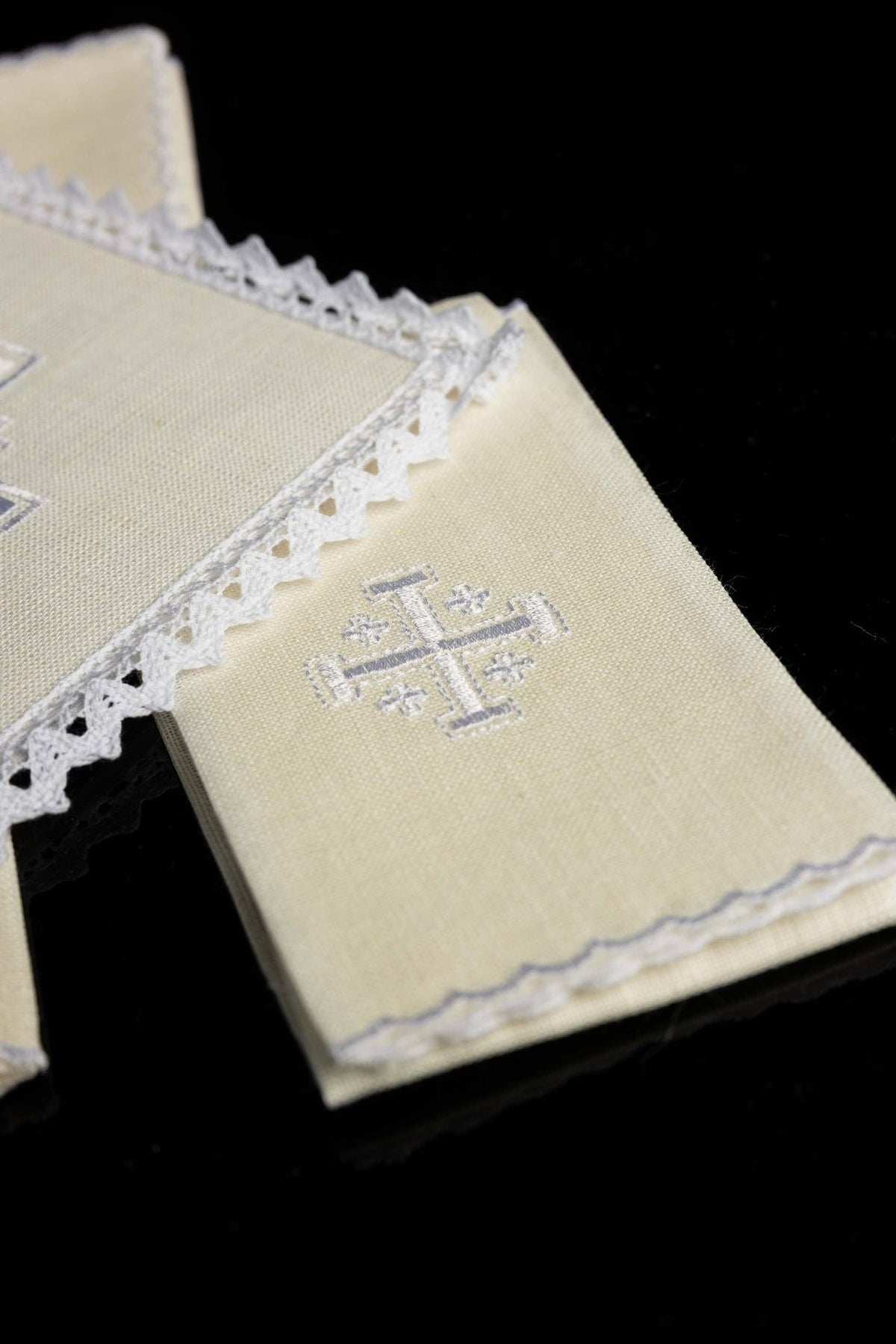 Altar linen set detail showing small Jerusalem cross embroidery and scalloped edge