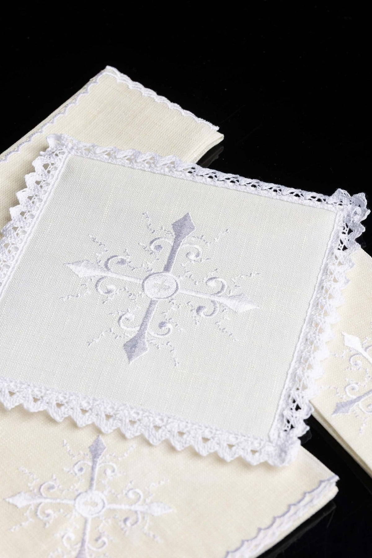 Altar linen set close-up of ornate cross embroidery on ivory linen