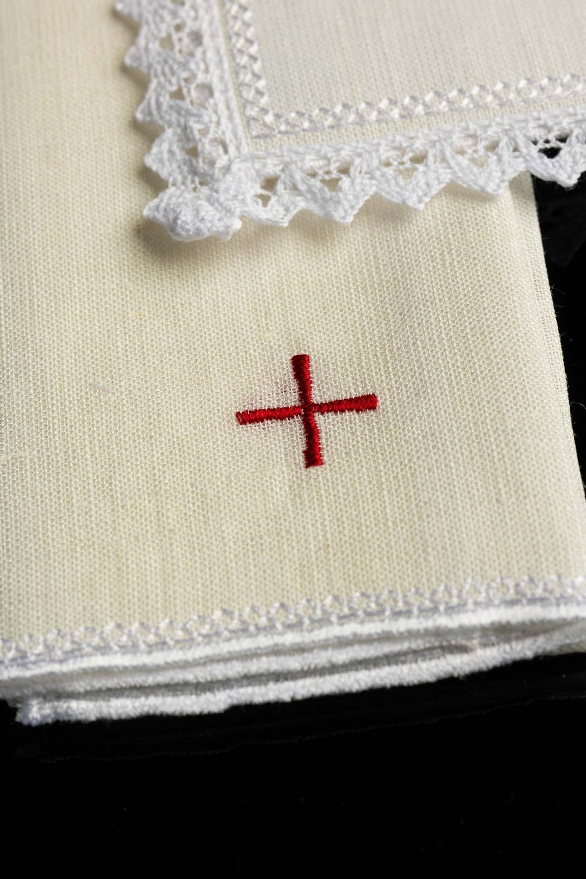 Altar linen set close-up showing red cross embroidery on linen fabric