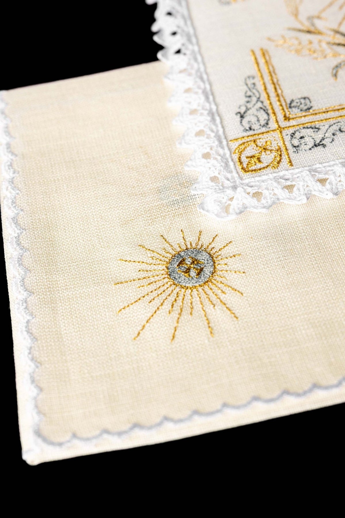 Altar linen set detail showing gold Eucharistic sunburst embroidery on white linen