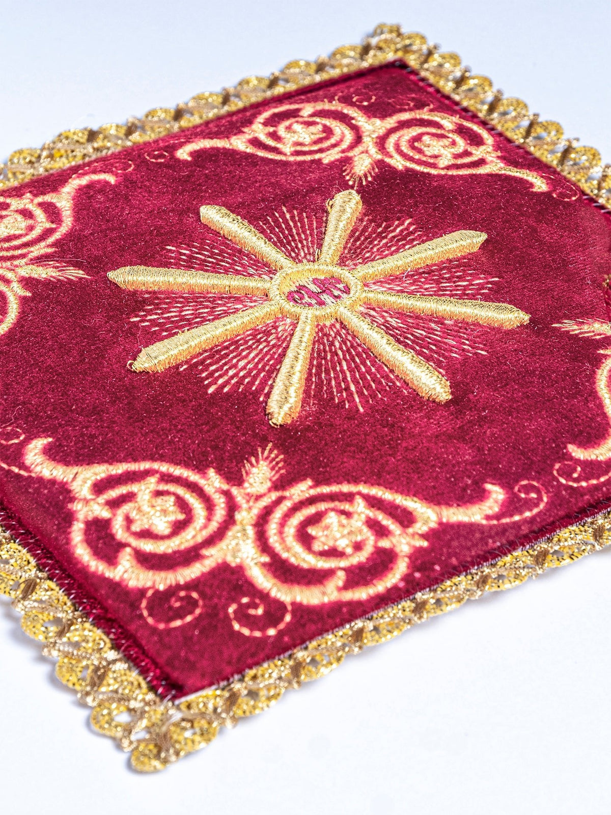 Red velvet chalice pall with gold Eucharistic embroidery and decorative trim