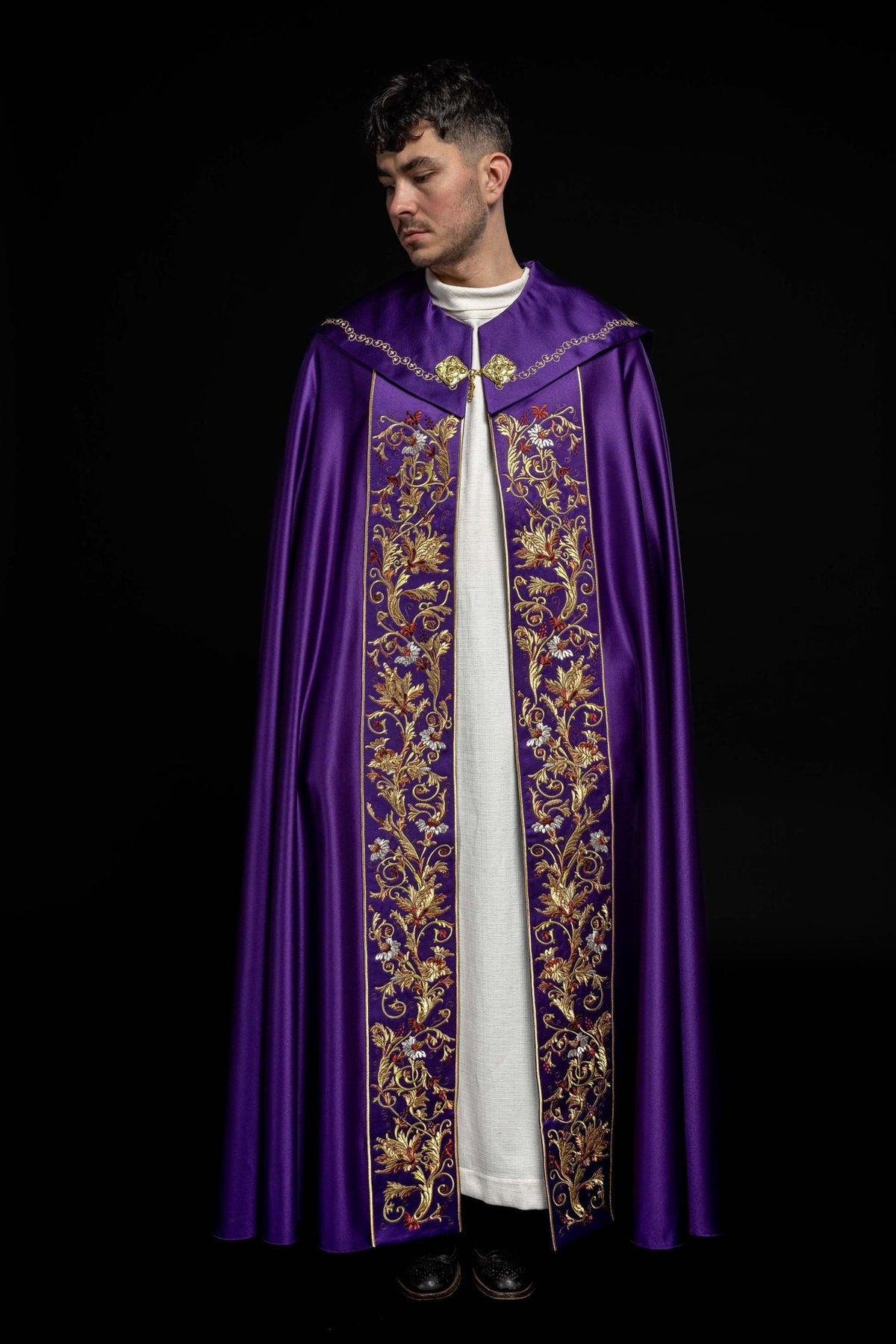 Purple Eucharistic Cope front view with ornate floral embroidery on the opening