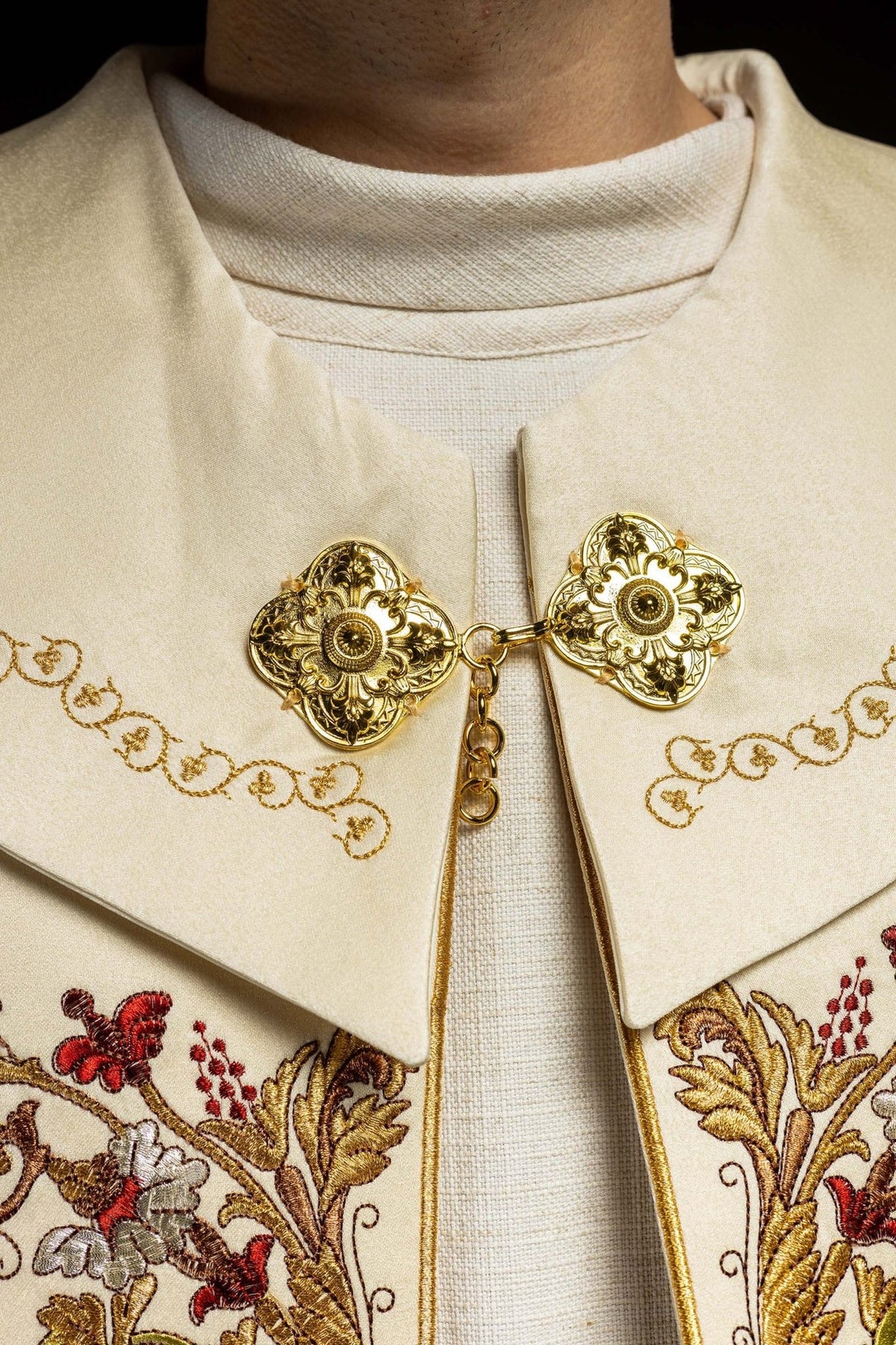 Ecru satin cope, close-up of gold clasp and embroidered floral panels