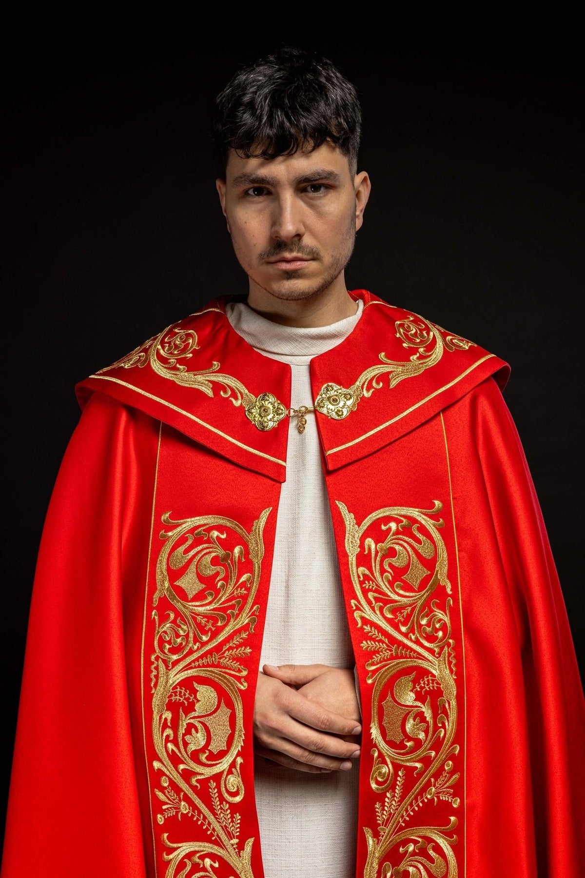 Red cope, back view with gold IHS embroidery and decorative tassel