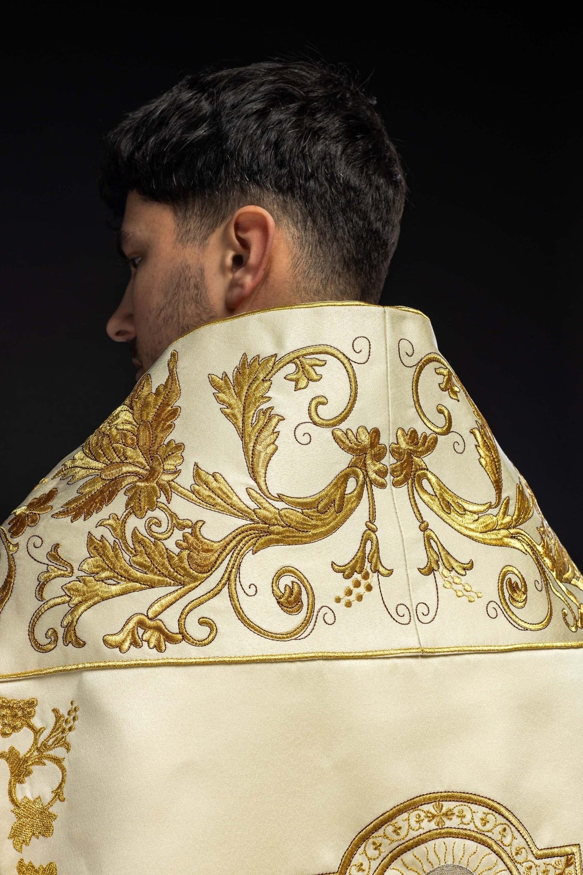 Ecru satin cope, close-up of upper back gold floral embroidery