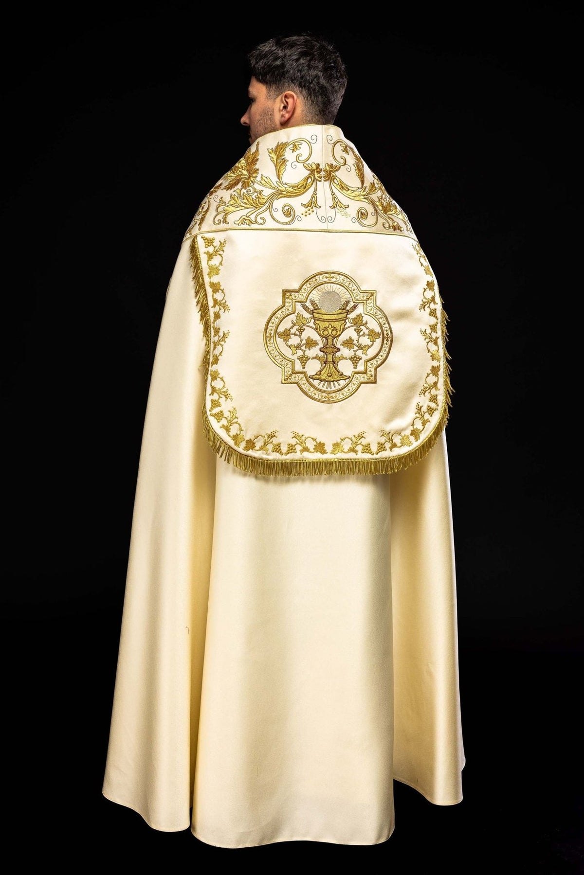 Ecru satin cope, full back view with chalice embroidery, floral border and fringe