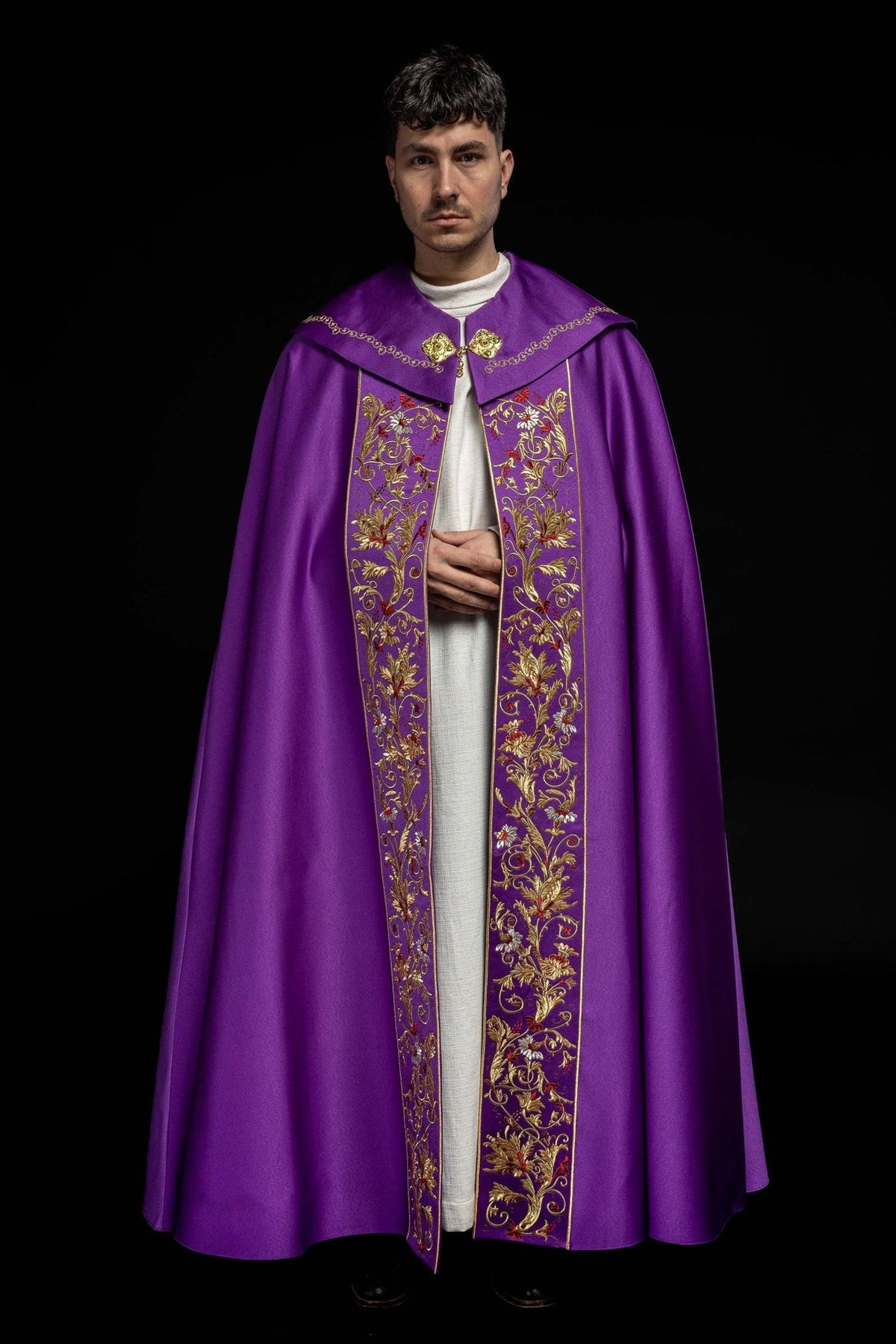 Purple cope, front view with ornate floral embroidery on the vertical panels