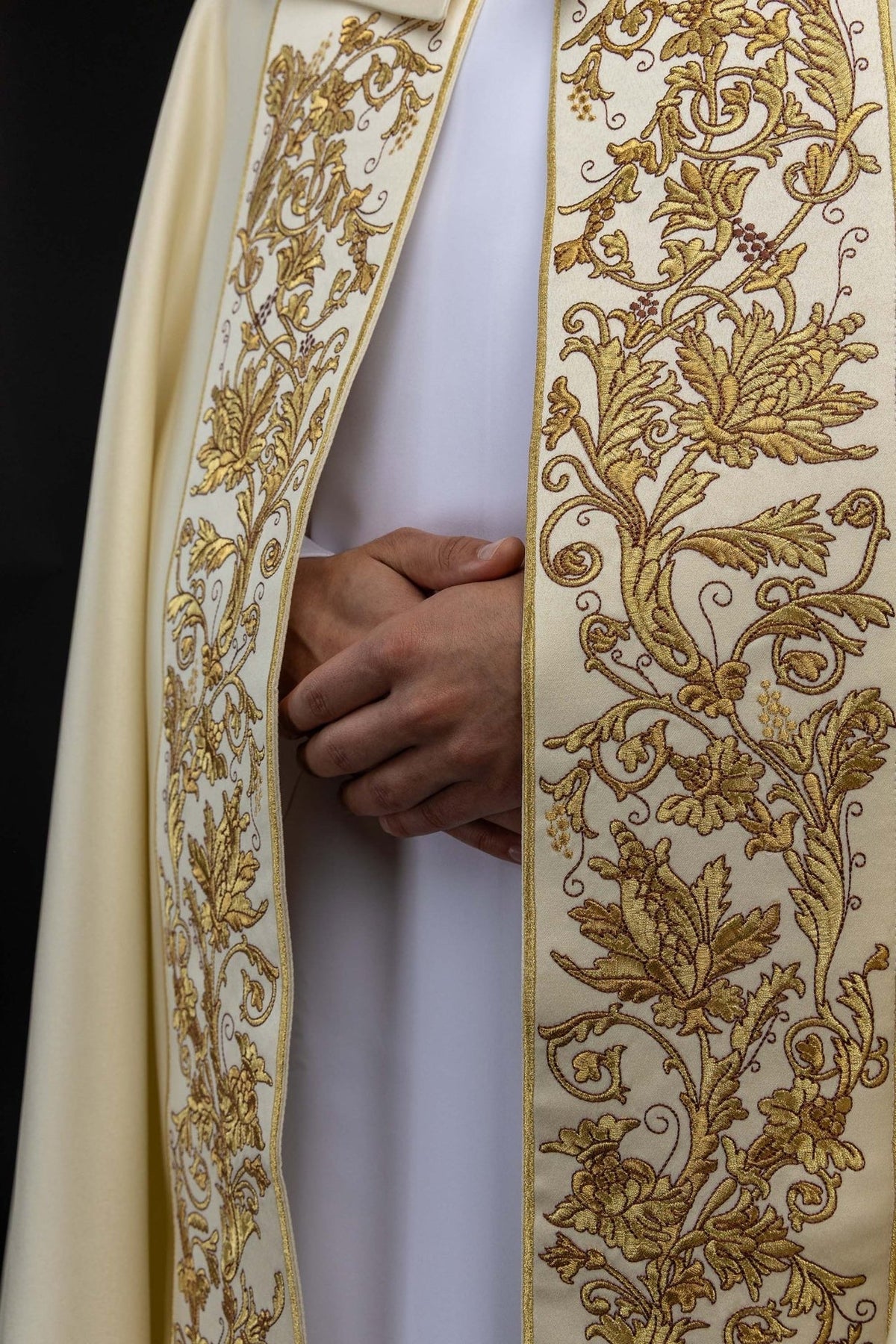 Ecru cope close-up of gold floral embroidery on front panel