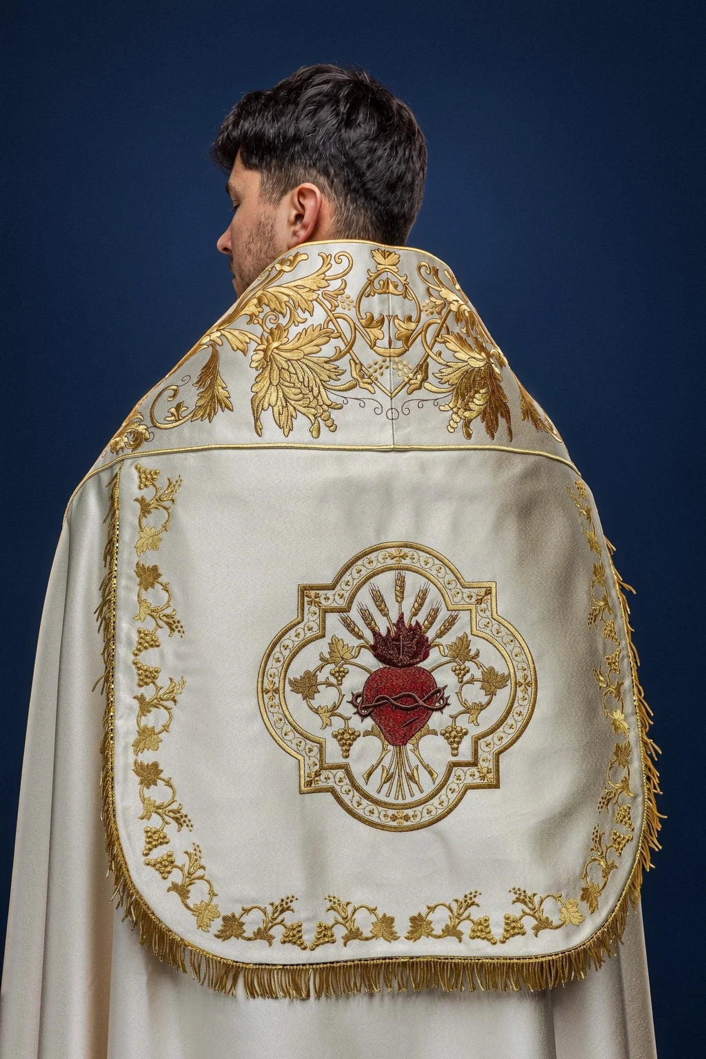 Ecru Satin Roman Cope with Embroidered Sacred Heart of Jesus, back view with gold embroidery and fringe