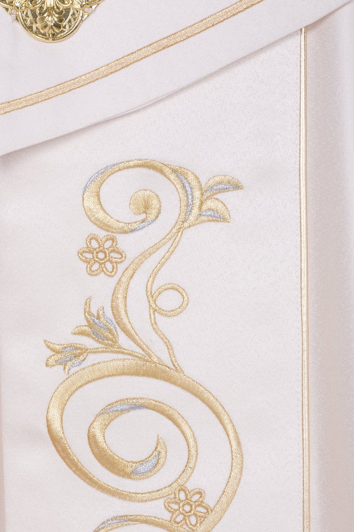 Ecru satin cope close-up showing gold scroll embroidery with floral details