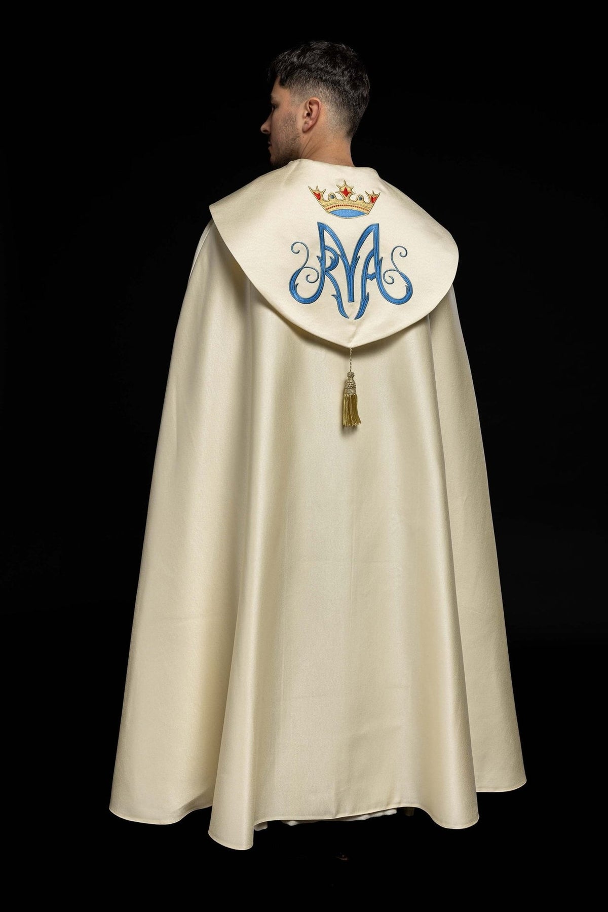 Marian ecru cope, back view with blue monogram, crowned emblem and gold tassel