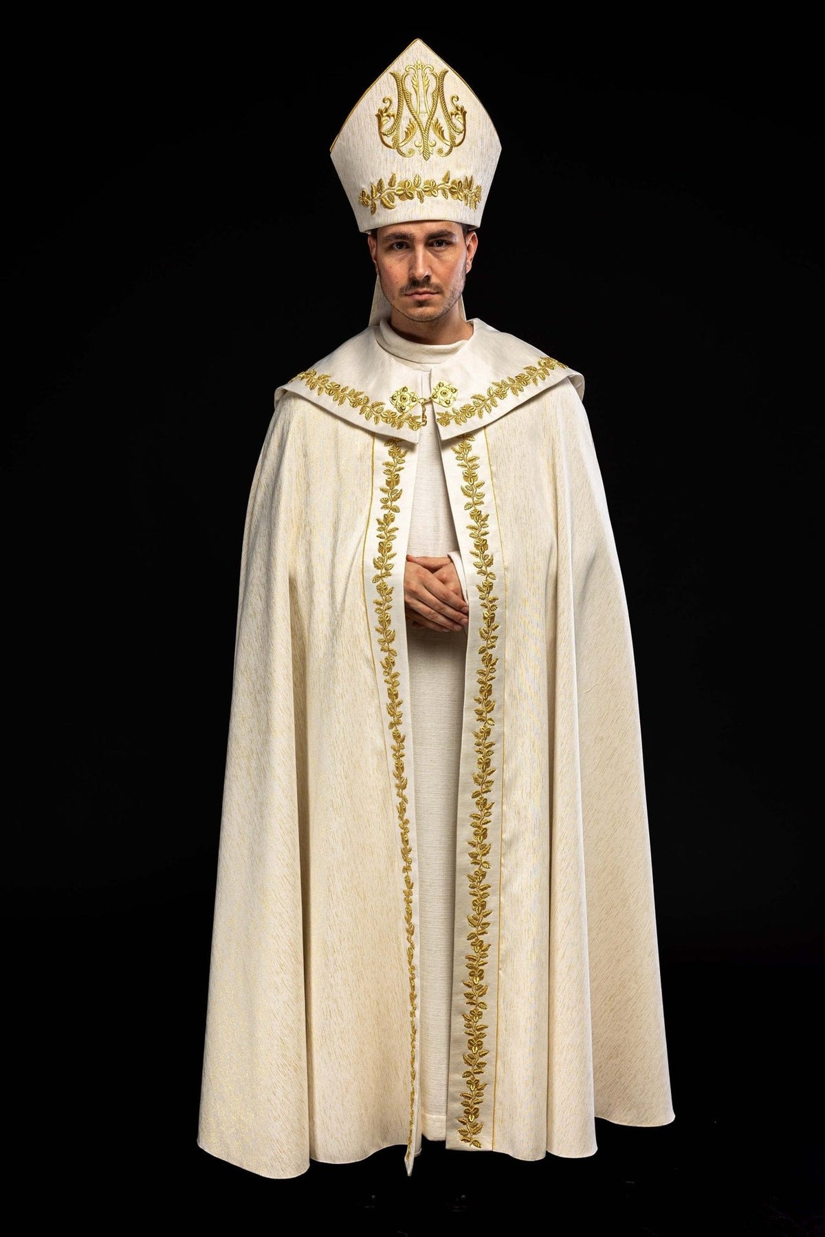 Marian cope worn with matching embroidered mitre, front view