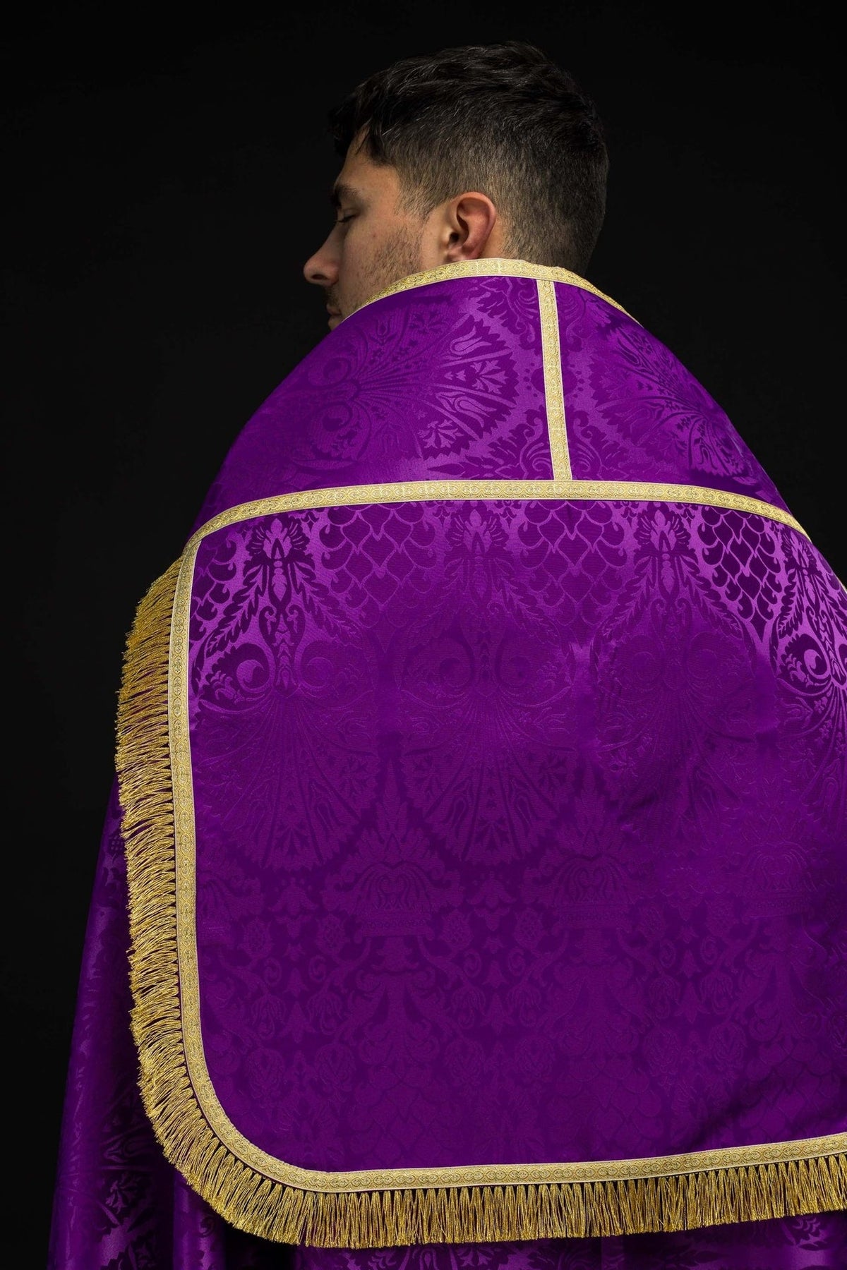 Roman cope back close-up showing purple jacquard, gold trim and fringe