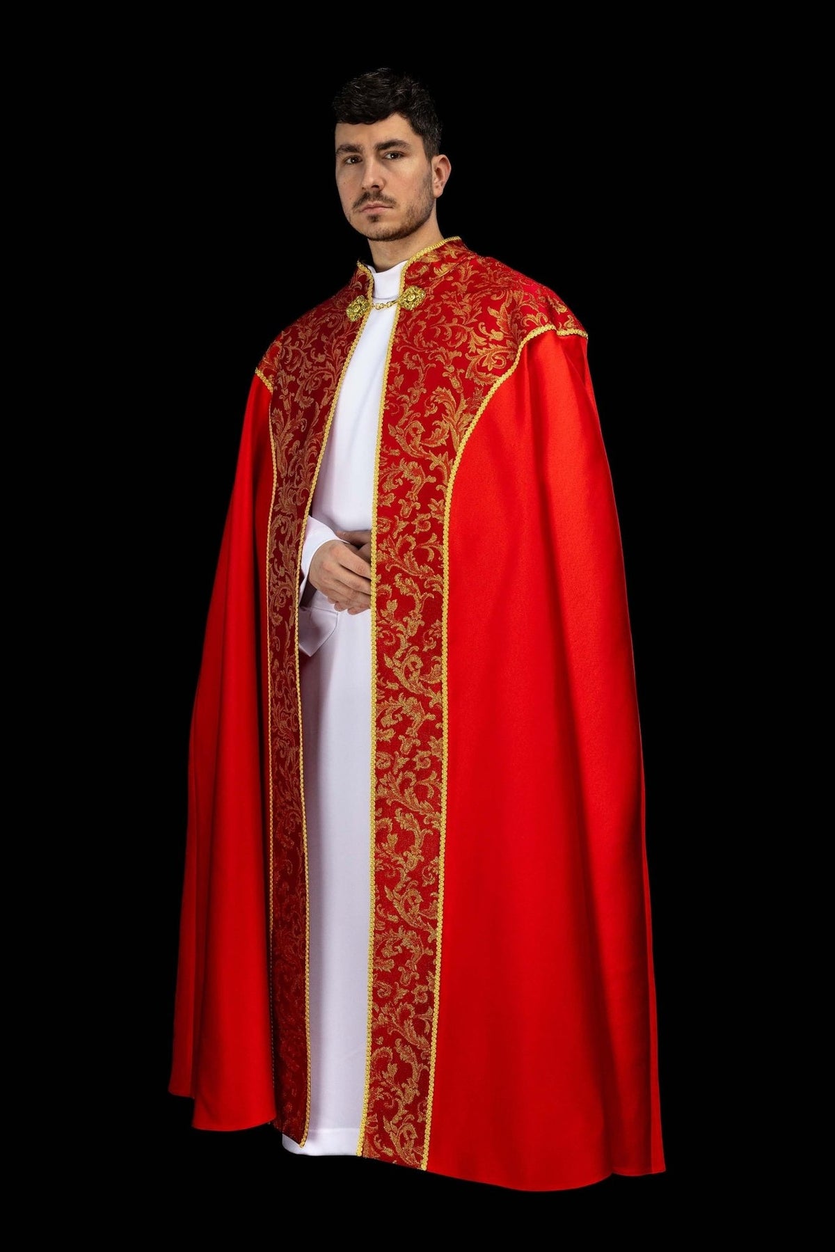 Red cope, angled front view with gold jacquard fabric panels and trim