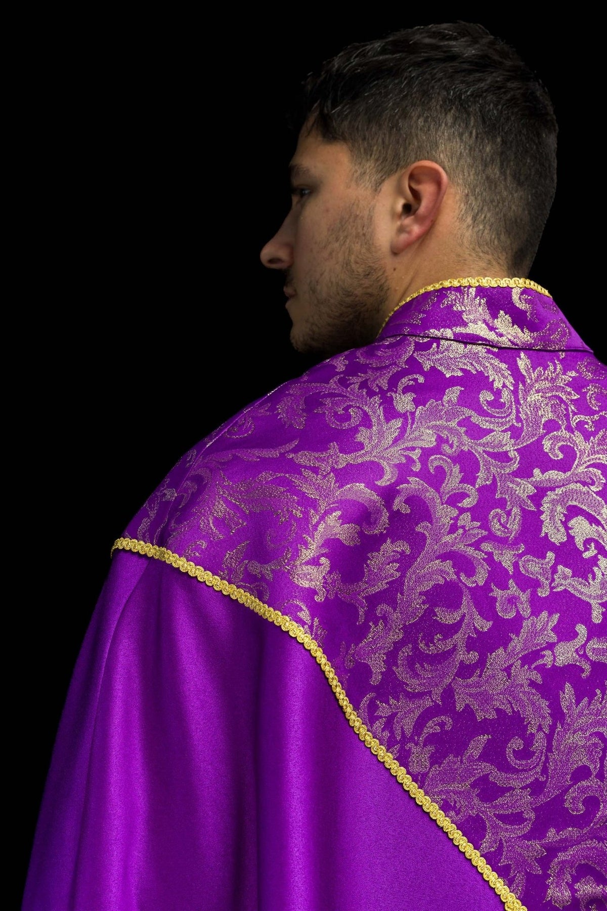 Purple cope back view with gold jacquard fabric yoke, trim and tassel