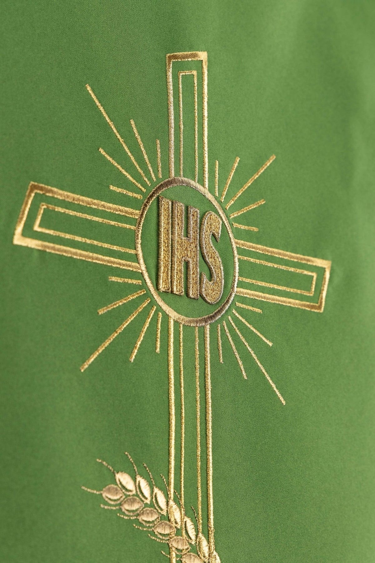 Church lectern cover close-up of embroidered gold IHS monogram and cross
