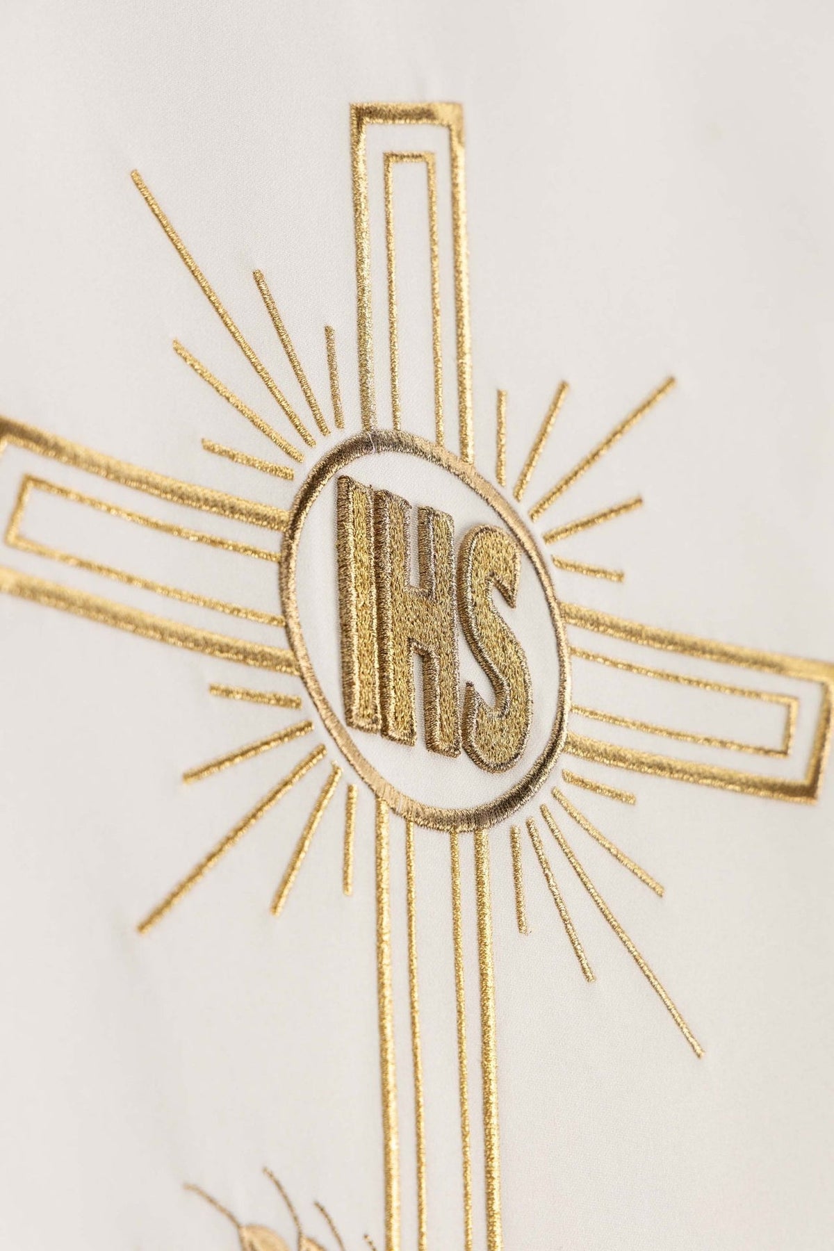 Ecru church lectern cover detail of gold cross embroidery with IHS monogram