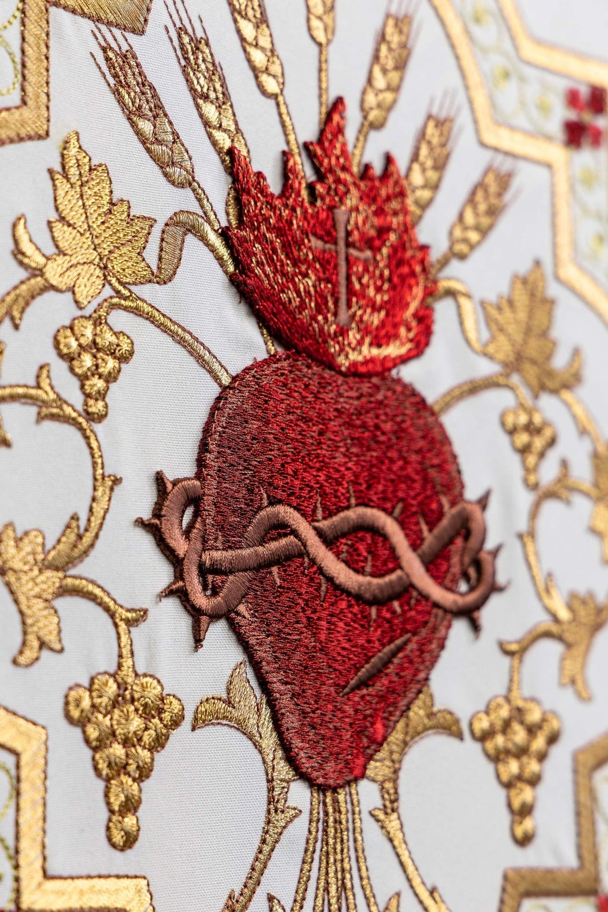 Church lectern cover detail of red Sacred Heart of Jesus embroidery with brown crown of thorns